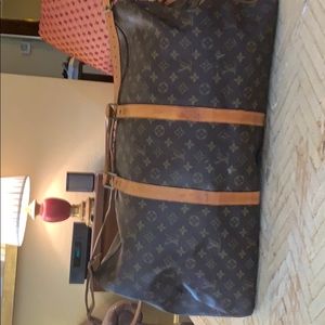 Louis Vuitton luggage. 22” in length 11” wide